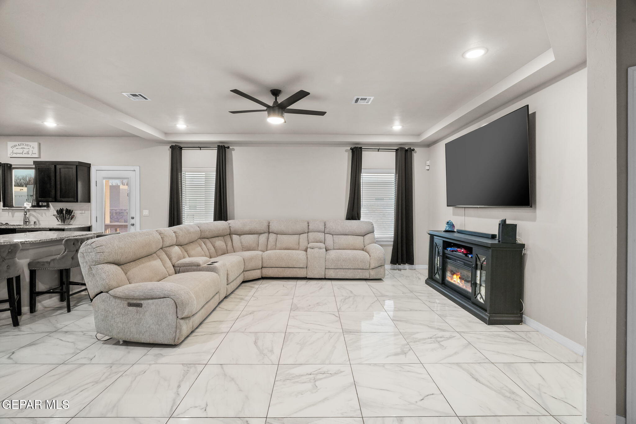 356 Plateau Drive Socorro, TX 79927 - Photo 5 of 51 a living room with furniture and a flat screen tv