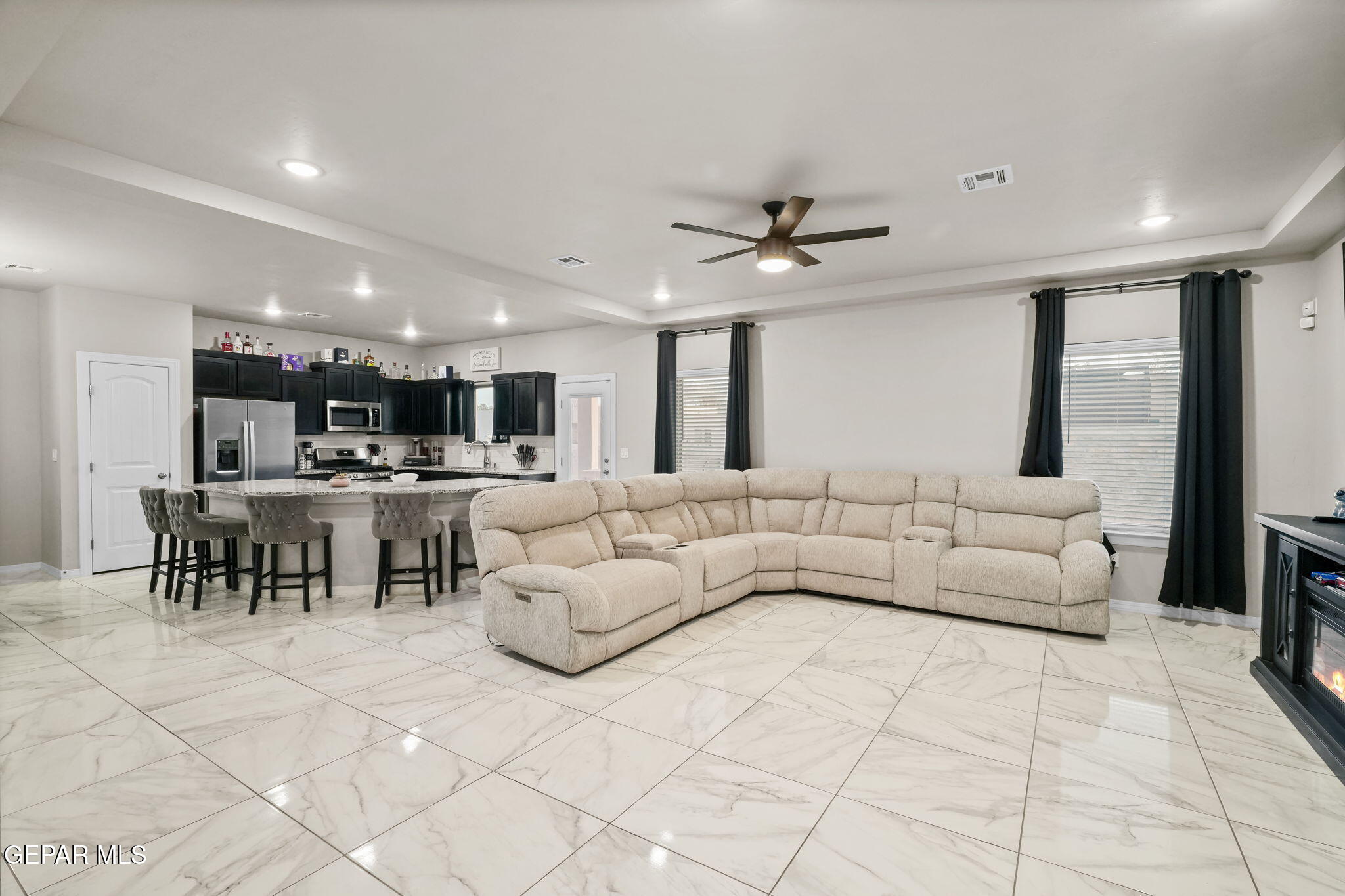 356 Plateau Drive Socorro, TX 79927 - Photo 6 of 51 a living room with furniture and view of kitchen