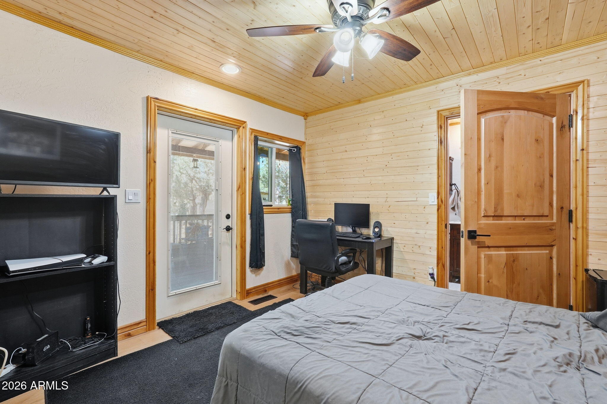 2060 Gilbert Lane Overgaard, AZ 85933 - Photo 44 of 87 a bedroom with a bed and a television
