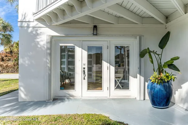 a kitchen with stainless steel appliances kitchen island granite countertop a stove refrigerator and cabinets