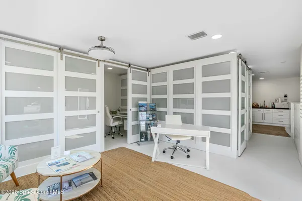 a view of a hallway with workspace
