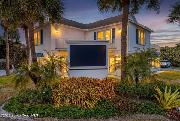 a view of a backyard with swimming pool