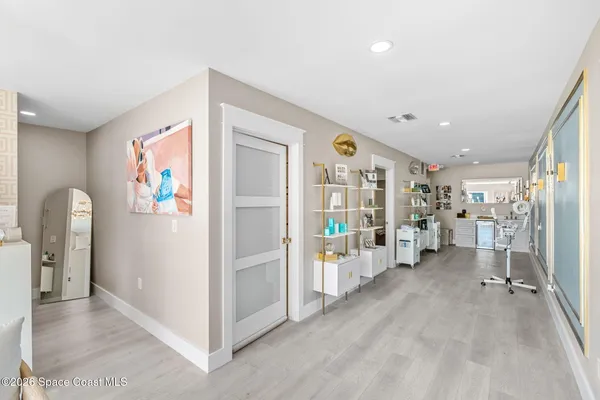 a room with a bed and a dresser