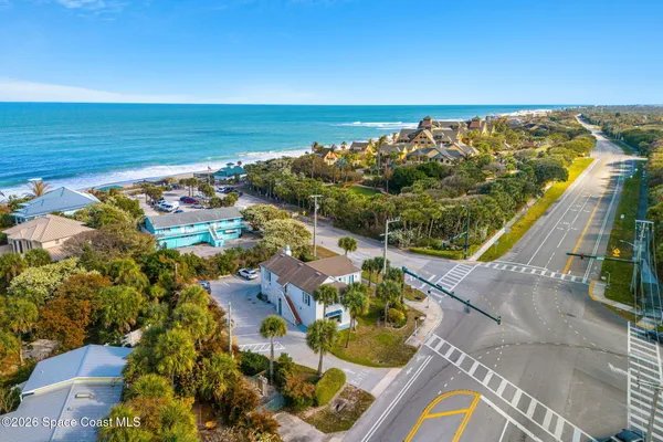 a view of a swimming pool with furniture