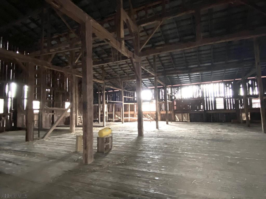 165 Springview Road Schellsburg, PA 15559 - Photo 40 of 63 a view of an empty room with wooden floor
