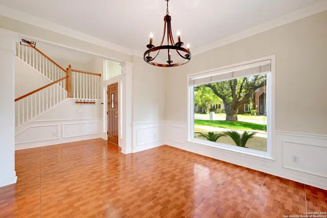 a view of an entryway with wooden floor