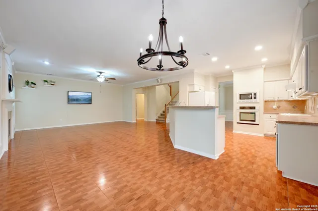 a view of kitchen and refrigerator