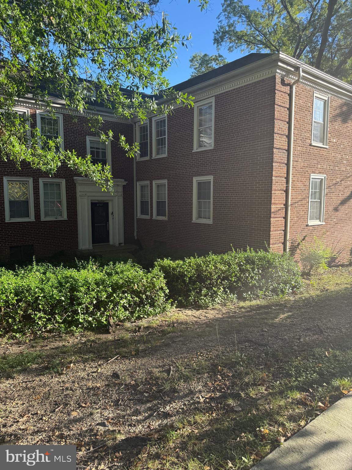 2711 Terrace Road Southeast, Unit 301 Washington, DC 20020 - Photo 4 of 6 a front view of a house with garden