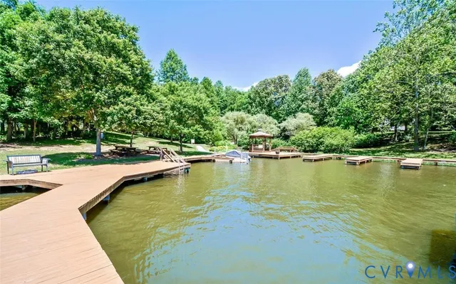 a view of a swimming pool with a yard