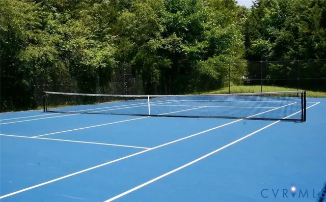 a view of a lake with a house in the background