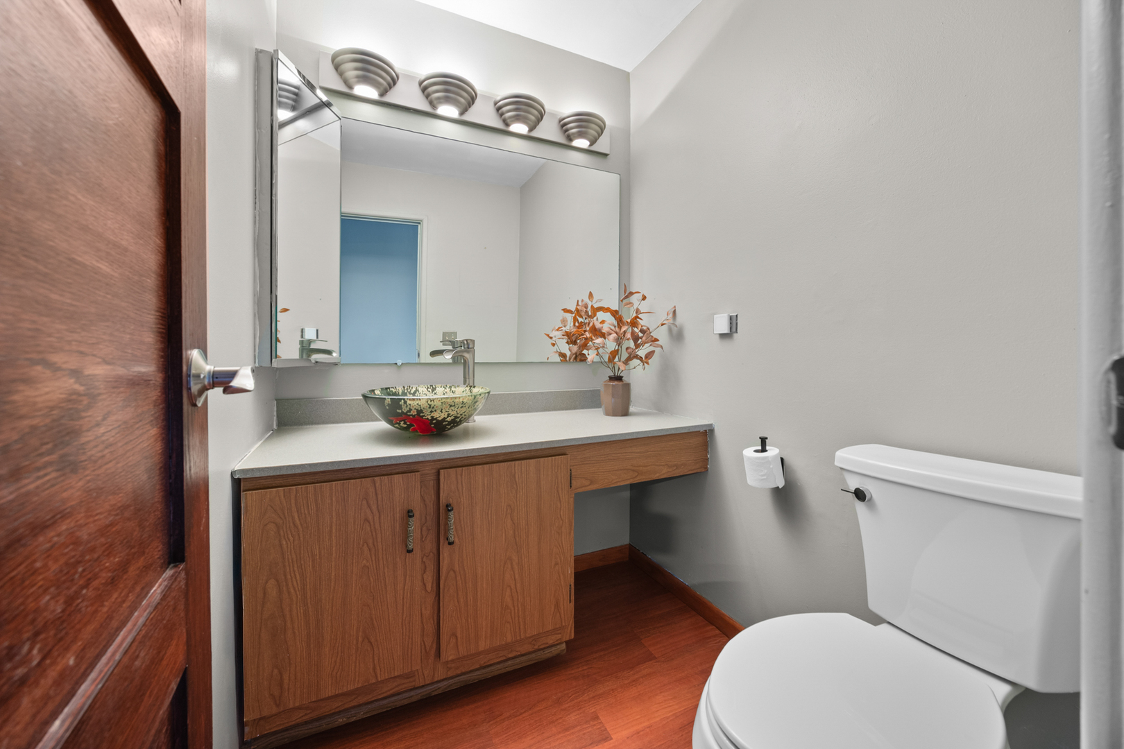 1567 California Street Elk Grove Village, IL 60007 - Photo 13 of 29 a bathroom with a sink a toilet a mirror and shower