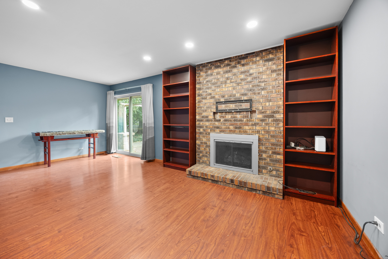 1567 California Street Elk Grove Village, IL 60007 - Photo 15 of 29 a view of an empty room with a fireplace and a window