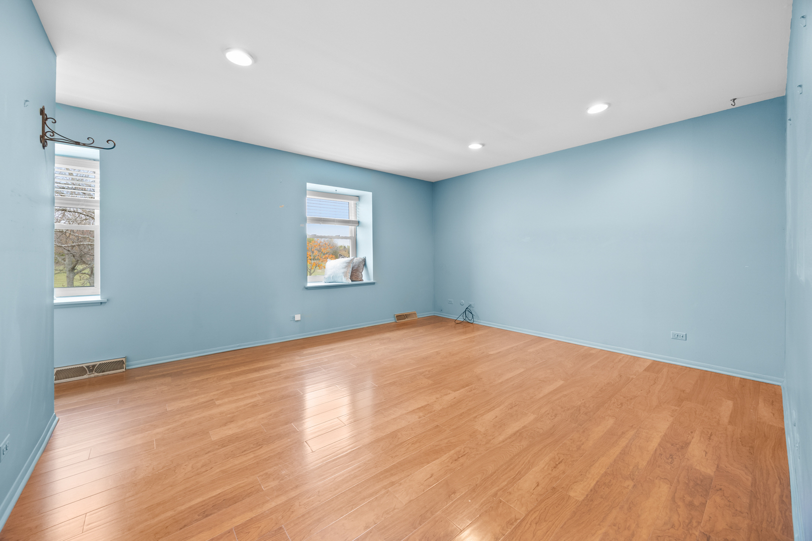 1567 California Street Elk Grove Village, IL 60007 - Photo 16 of 29 a view of an empty room with wooden floor and a window