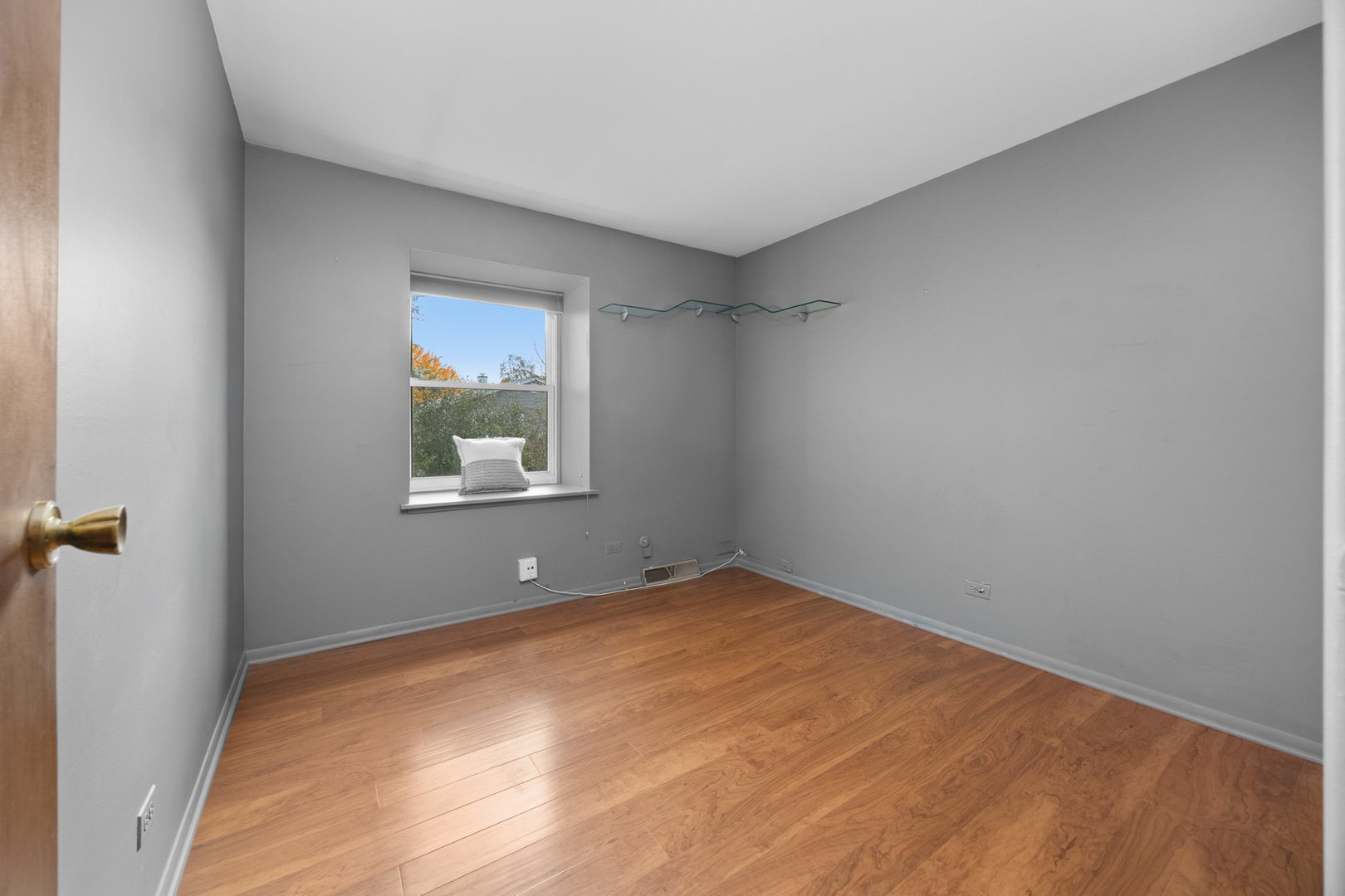 1567 California Street Elk Grove Village, IL 60007 - Photo 23 of 29 an empty room with a window