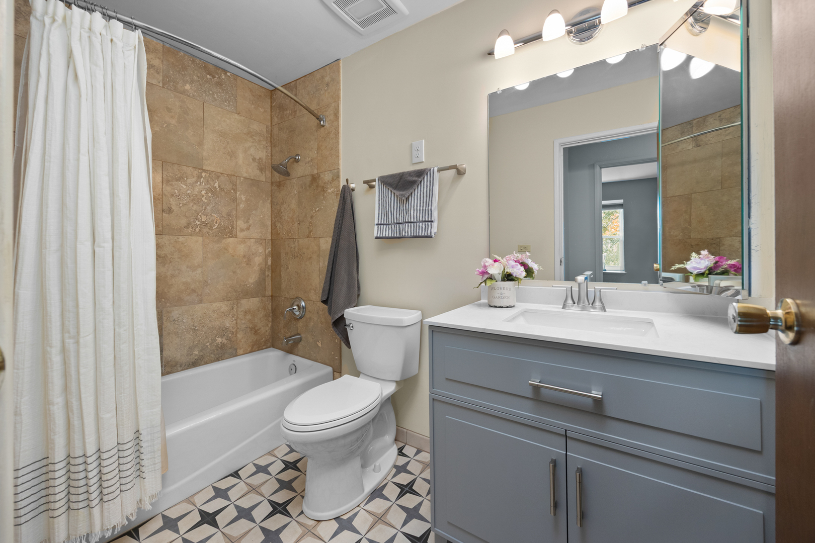 1567 California Street Elk Grove Village, IL 60007 - Photo 24 of 29 a bathroom with a sink a toilet a mirror and shower