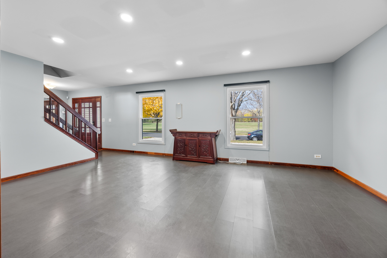 1567 California Street Elk Grove Village, IL 60007 - Photo 3 of 29 a view of an empty room with wooden floor and a window