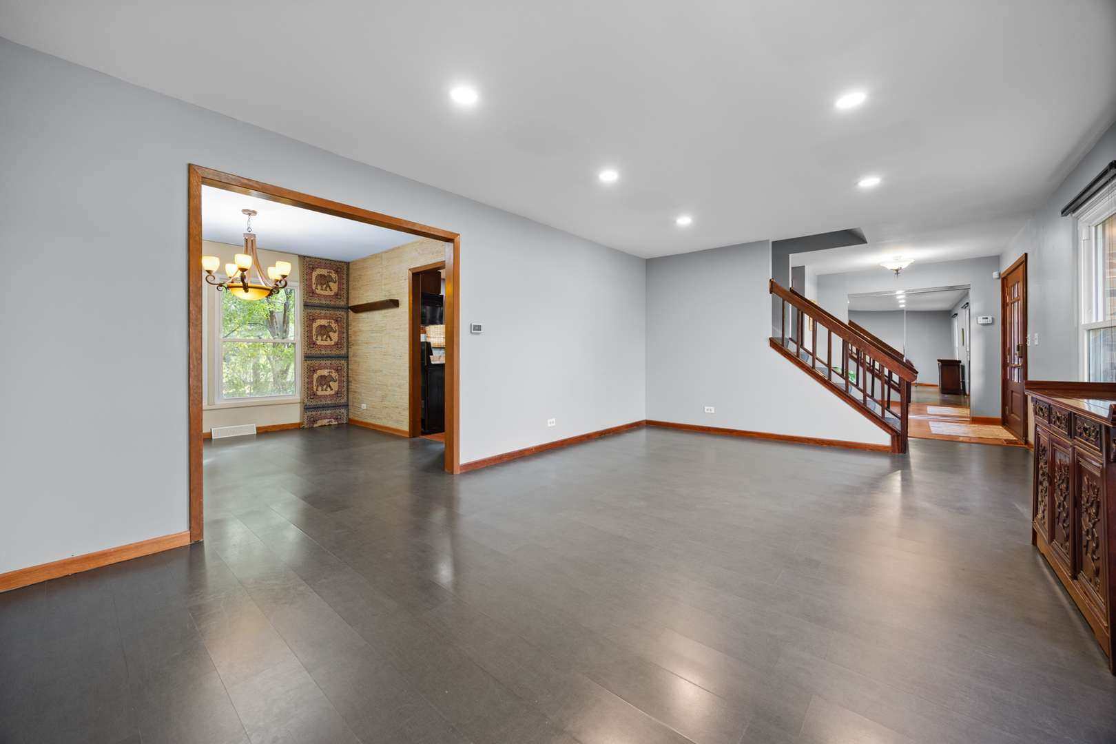 1567 California Street Elk Grove Village, IL 60007 - Photo 5 of 29 an empty room with wooden floor and windows