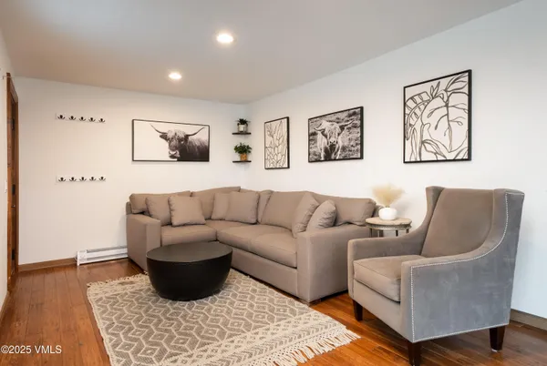 a living room with furniture and a rug