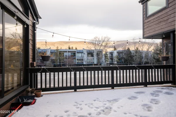 a view of a street view from a balcony