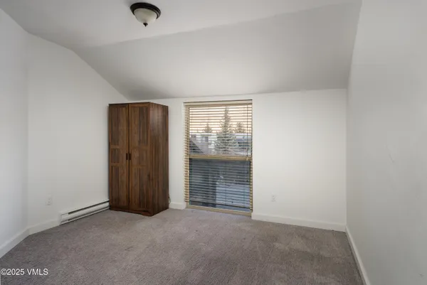 an empty room with closet area
