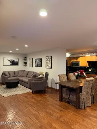 a living room with furniture and a table
