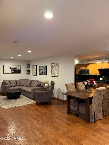 a living room with furniture and a table