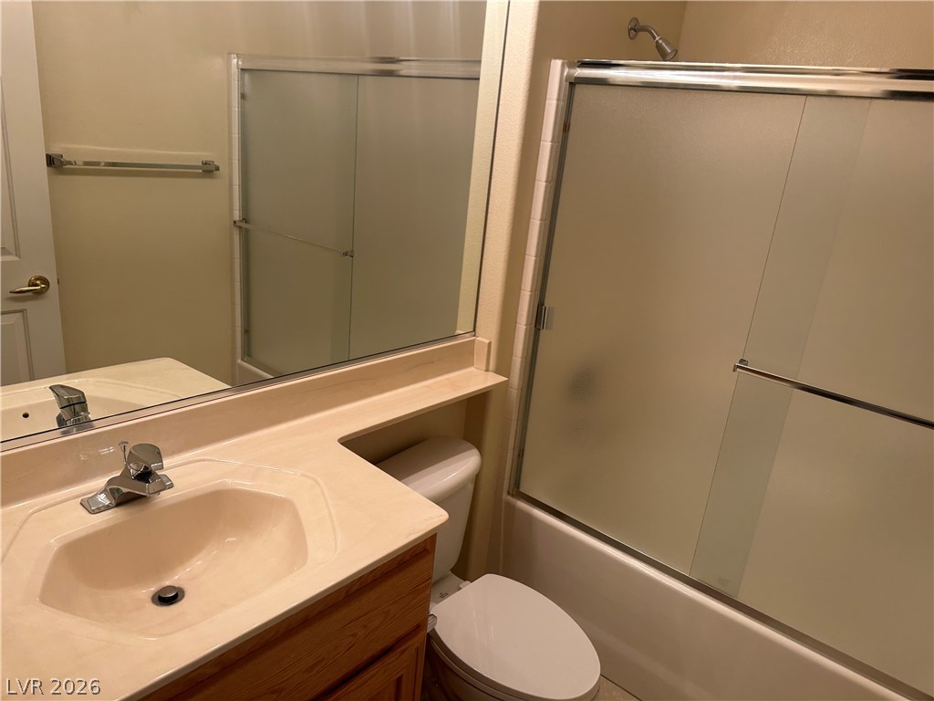 3034 Canal Walk Road Henderson, NV 89052 - Photo 8 of 24 This clean bathroom features a convenient shower-tub combination and a practical vanity with ample counter space.