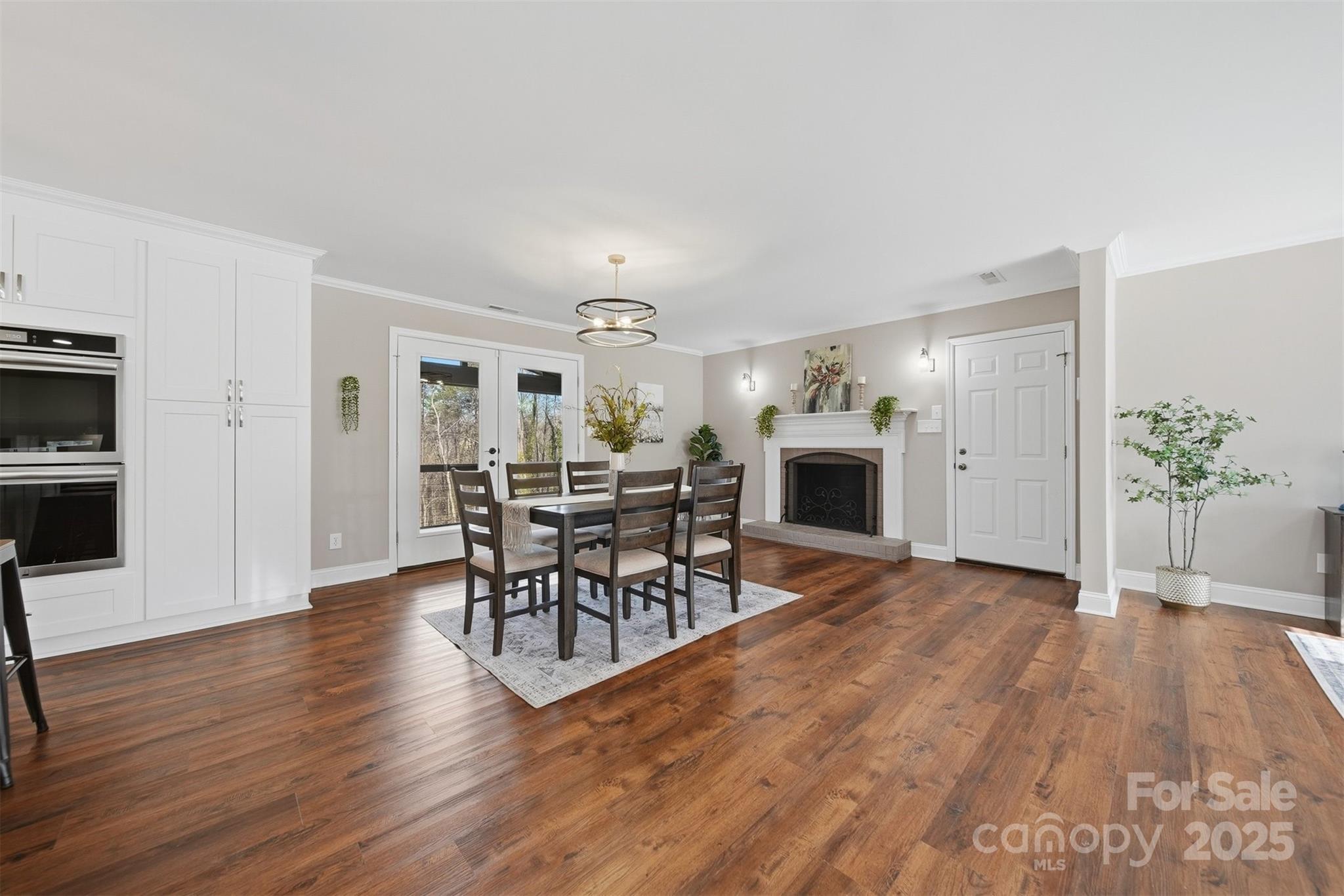 315 Skyline Road Hickory, NC 28601 - Photo 12 of 48 a view of a dining room with furniture and wooden floor