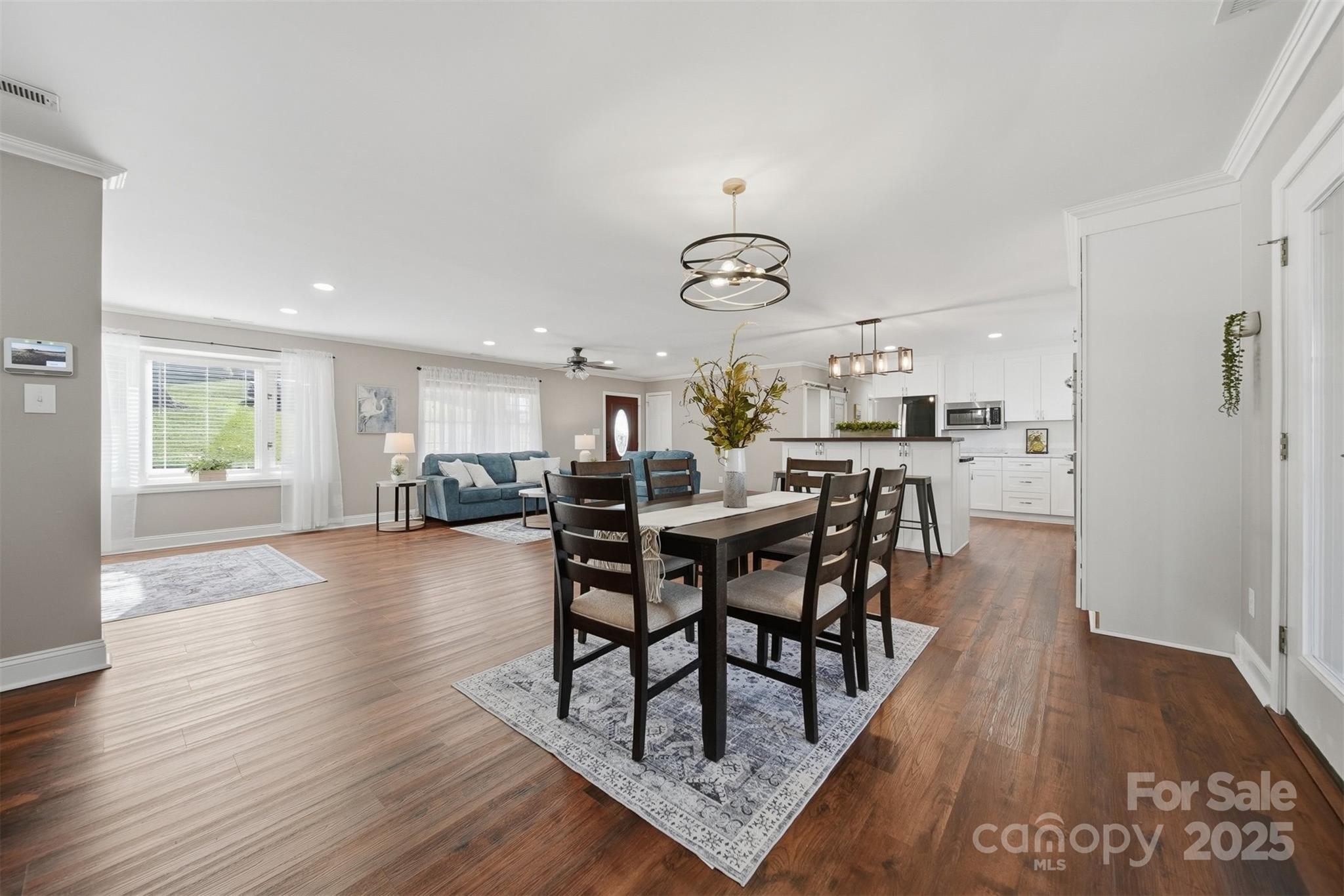 315 Skyline Road Hickory, NC 28601 - Photo 13 of 48 a view of a dining room with furniture and wooden floor