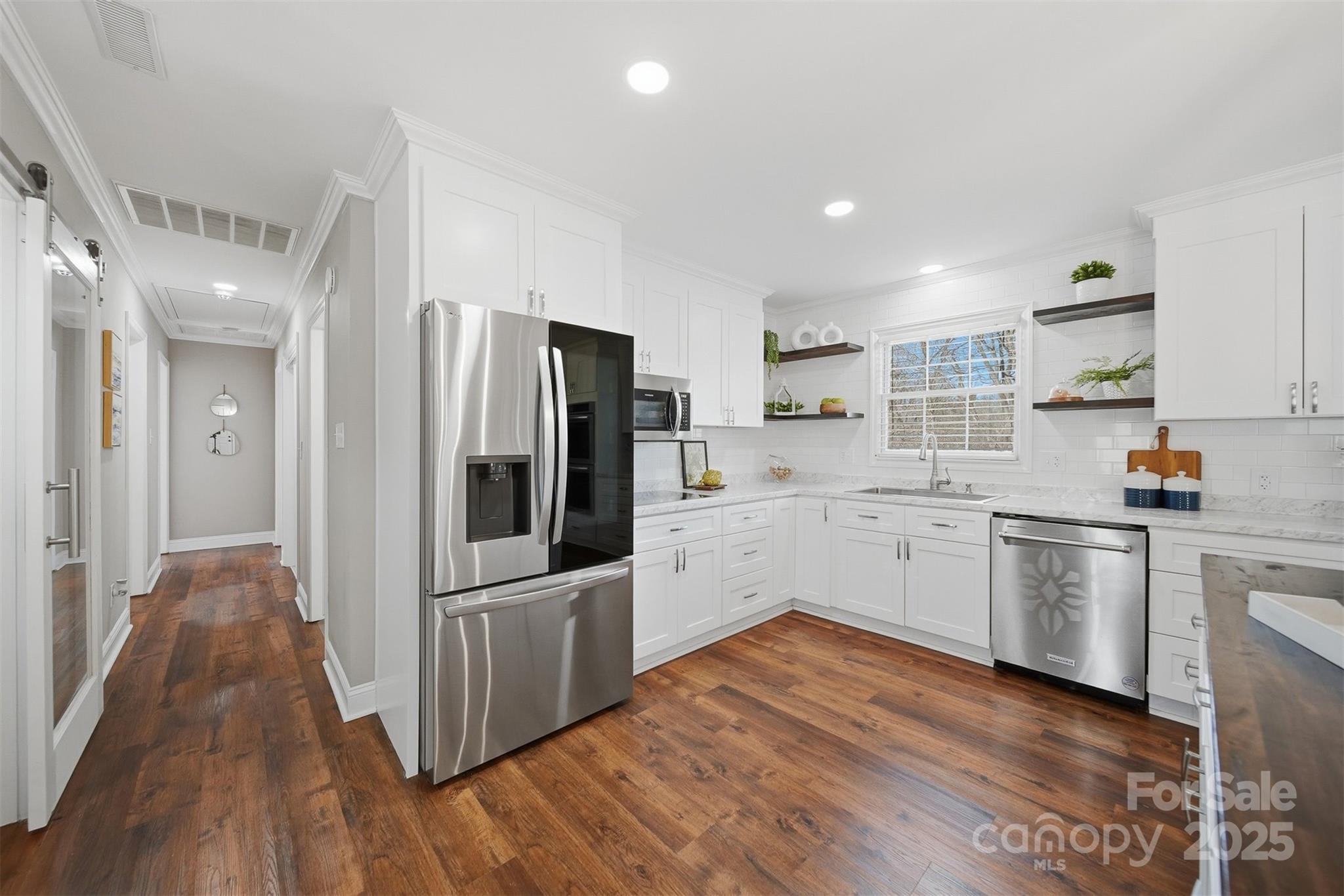 315 Skyline Road Hickory, NC 28601 - Photo 16 of 48 a kitchen with granite countertop a refrigerator and a sink