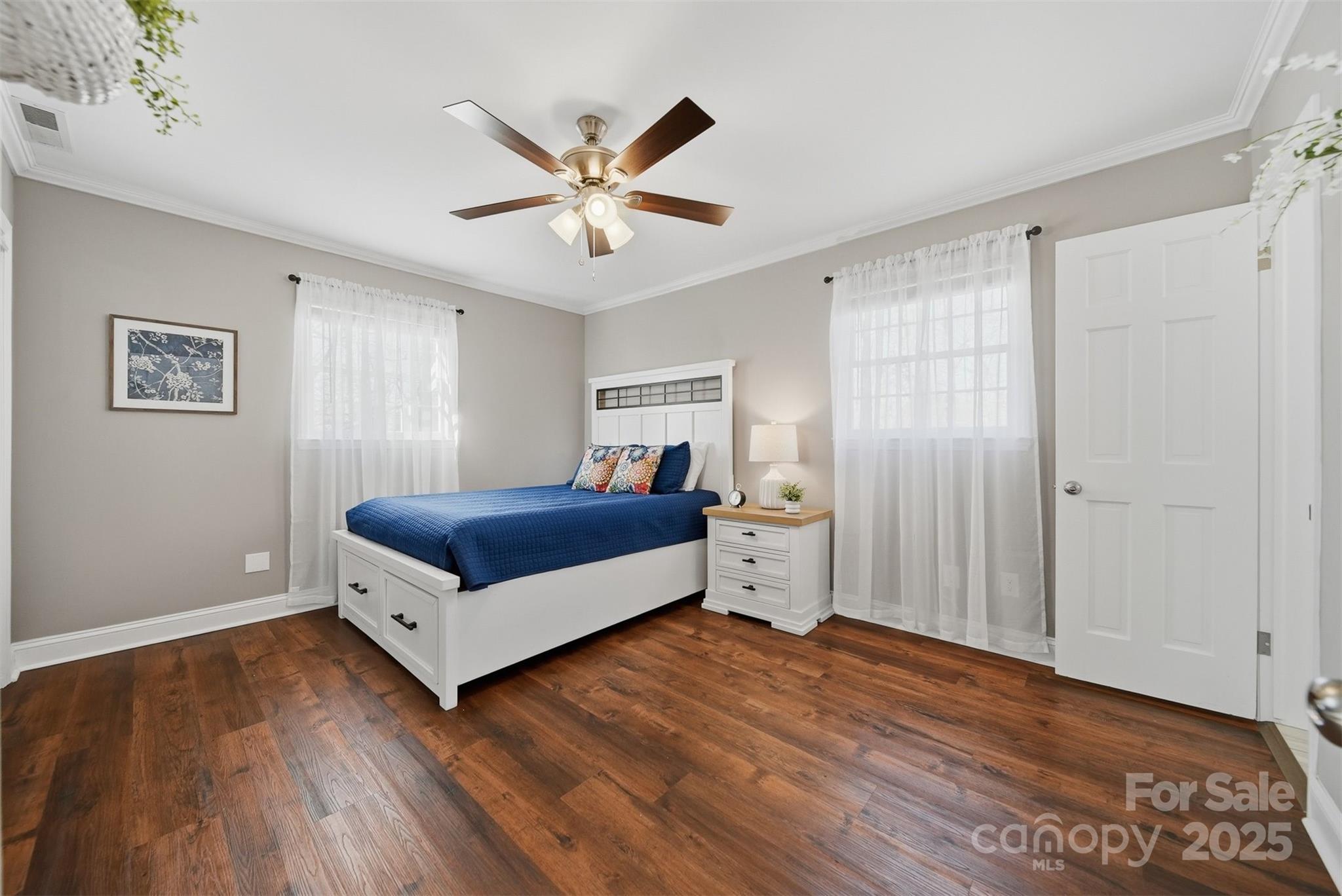 315 Skyline Road Hickory, NC 28601 - Photo 21 of 48 a bedroom with a bed and a chandelier