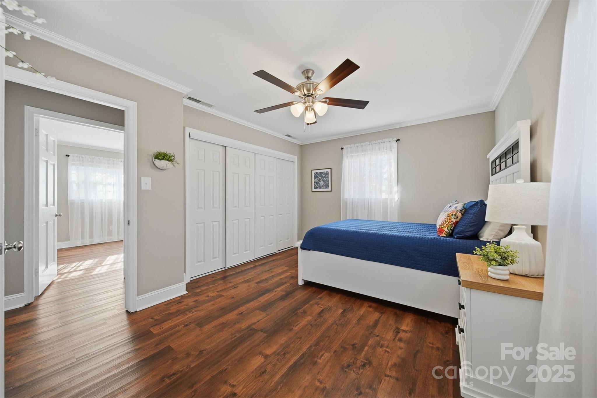 315 Skyline Road Hickory, NC 28601 - Photo 22 of 48 a bedroom with a bed and a chandelier