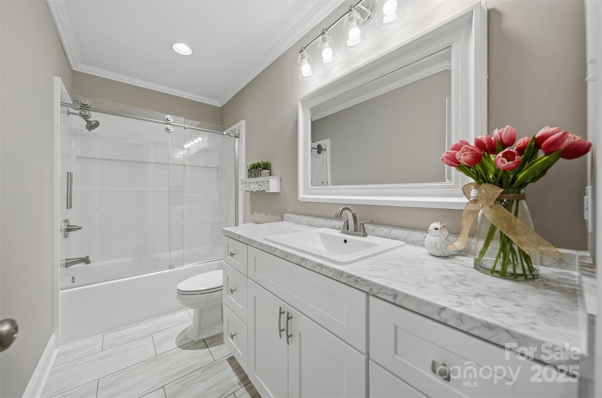 315 Skyline Road Hickory, NC 28601 - Photo 26 of 48 a bathroom with a granite countertop sink mirror vanity toilet and shower