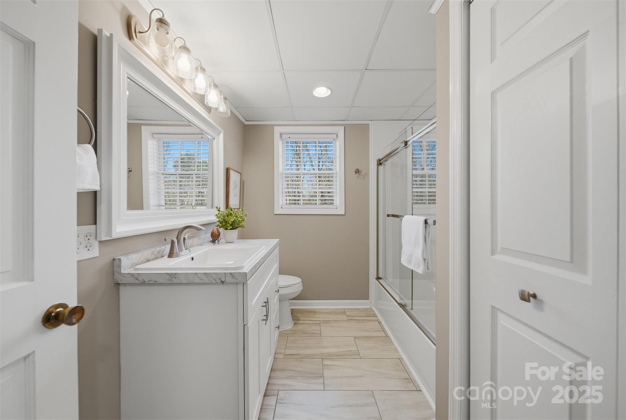 315 Skyline Road Hickory, NC 28601 - Photo 33 of 48 a bathroom with a granite countertop sink a mirror and shower