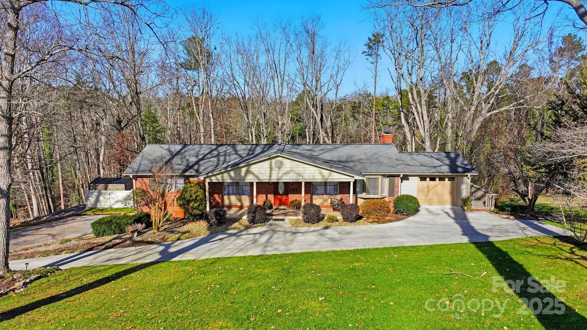 315 Skyline Road Hickory, NC 28601 - Photo 35 of 48 a view of a patio with table and chairs under an umbrella