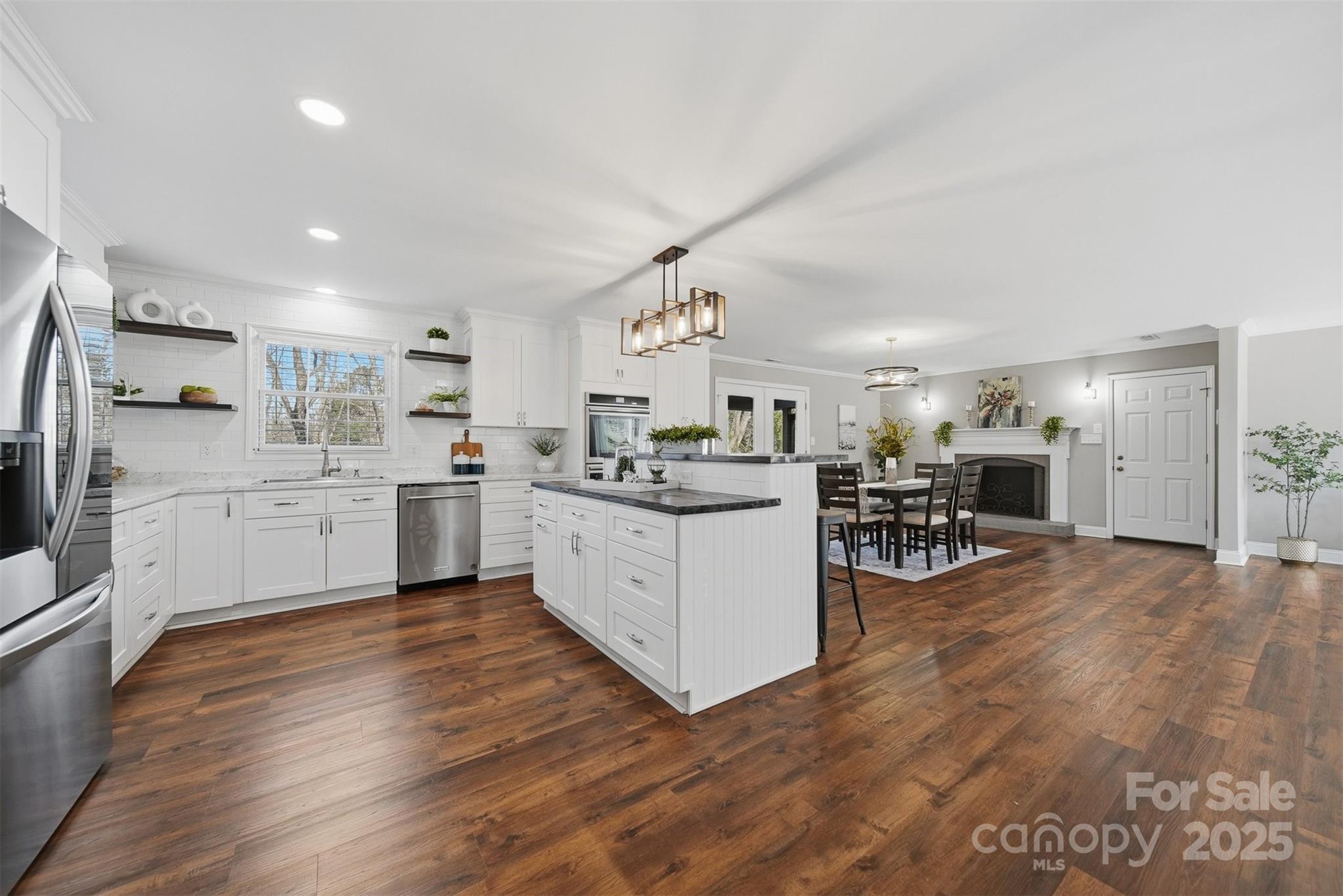 315 Skyline Road Hickory, NC 28601 - Photo 10 of 48 a kitchen with a sink cabinets and wooden floor