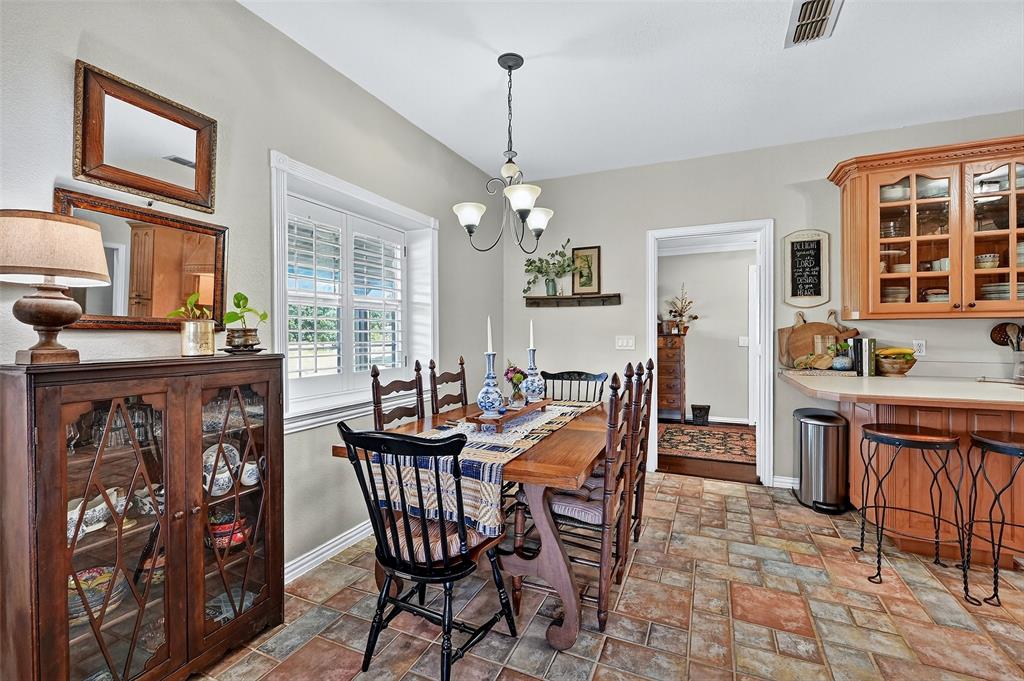 12041 Bell Road Pilot Point, TX 76258 - Photo 13 of 38 a view of a dining room with furniture window and wooden floor