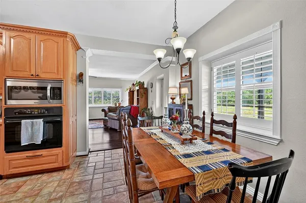 a view of a dining room with furniture window and outside view