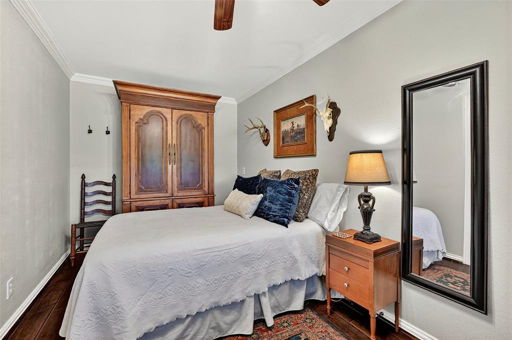 12041 Bell Road Pilot Point, TX 76258 - Photo 15 of 38 a bedroom with a bed and wooden floor