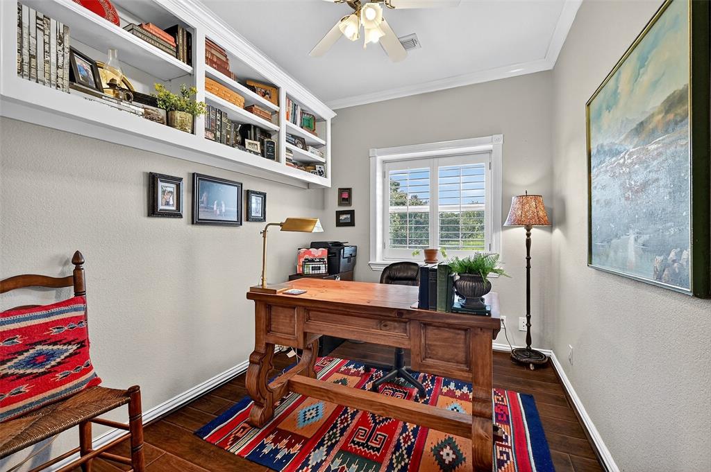 12041 Bell Road Pilot Point, TX 76258 - Photo 17 of 38 a living room with furniture and a bookshelf