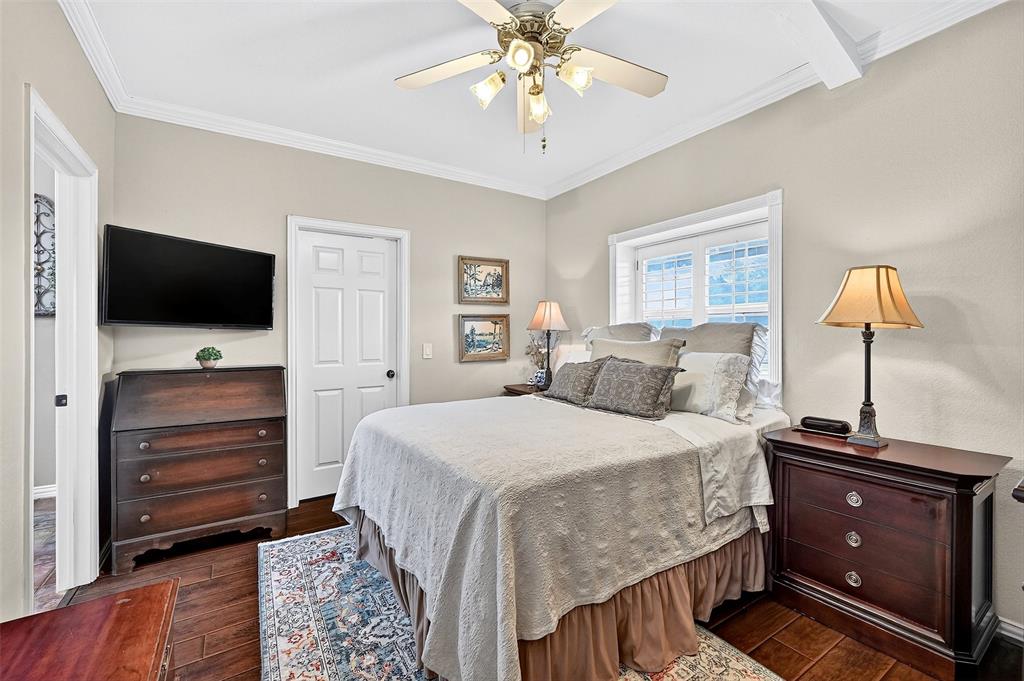 12041 Bell Road Pilot Point, TX 76258 - Photo 19 of 38 a bedroom with a bed and a flat screen tv