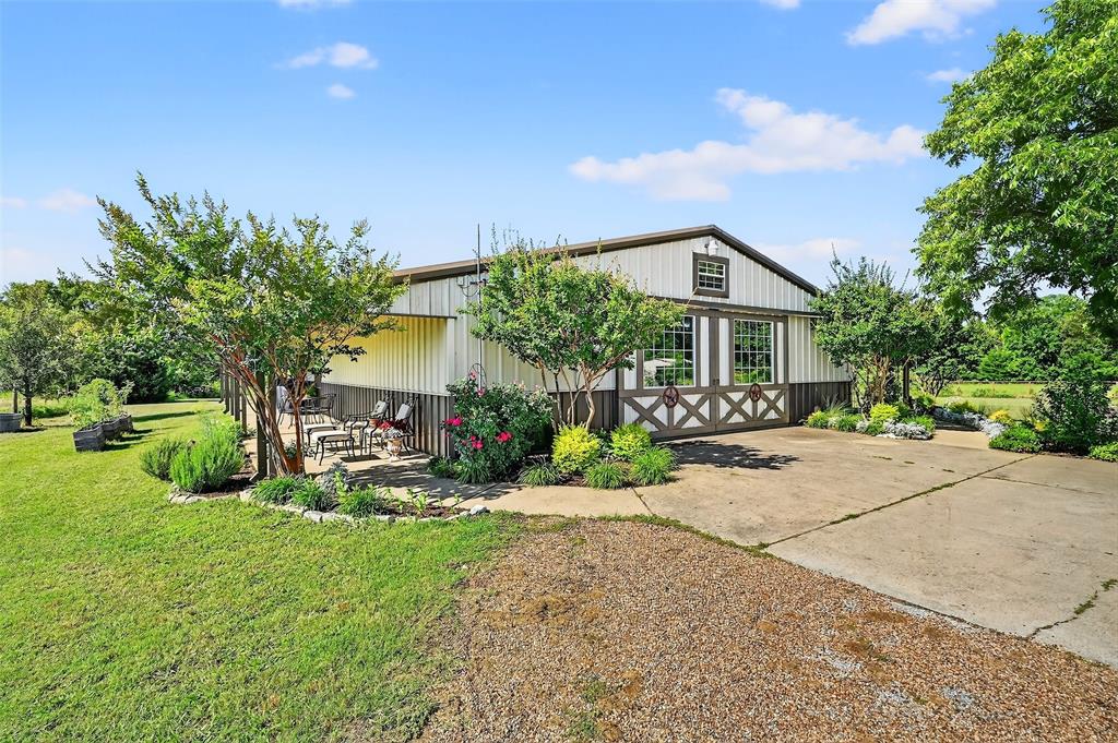 12041 Bell Road Pilot Point, TX 76258 - Photo 2 of 38 a front view of a house with a yard and tree s