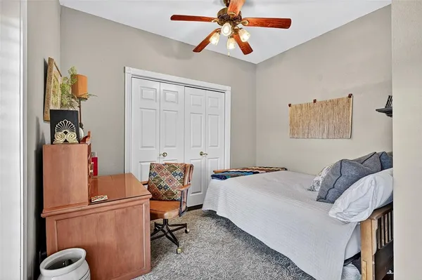 a bedroom with a bed and furniture