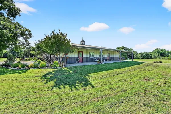 a view of a house with a big yard