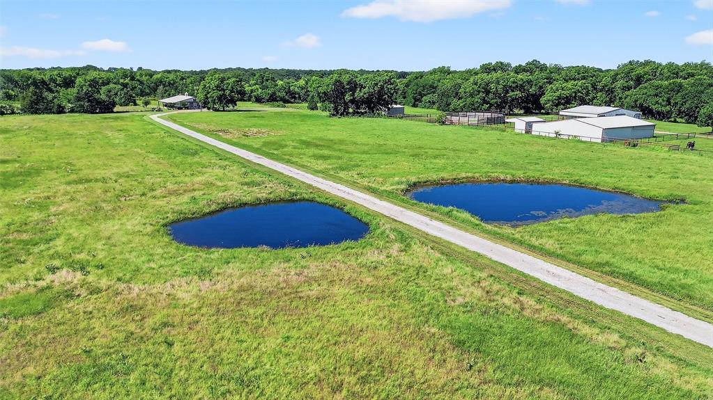 12041 Bell Road Pilot Point, TX 76258 - Photo 35 of 38 a view of an outdoor space and a yard