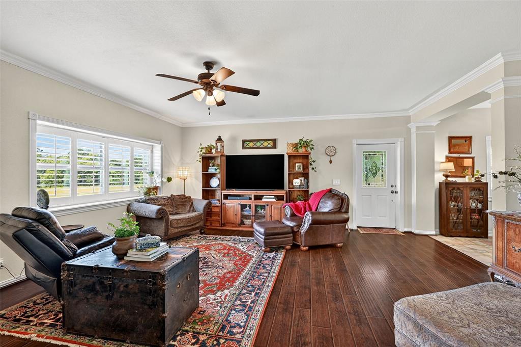 12041 Bell Road Pilot Point, TX 76258 - Photo 6 of 38 a living room with furniture or couch and a flat screen tv