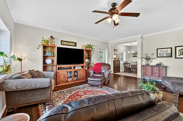 a living room with furniture and a flat screen tv