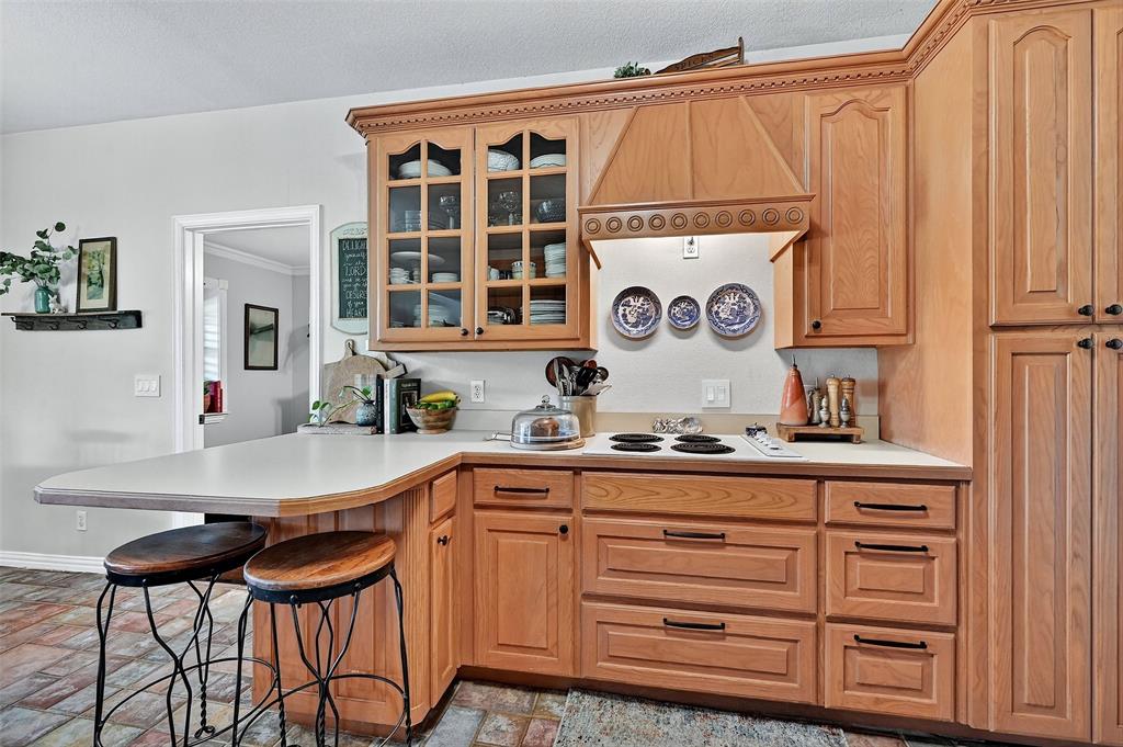 12041 Bell Road Pilot Point, TX 76258 - Photo 10 of 38 a kitchen with a sink and cabinets
