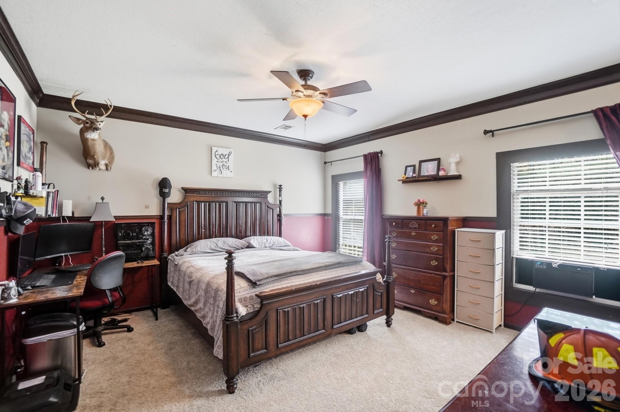 158 Cooks Lake Road Gastonia, NC 28056 - Photo 13 of 27 a bedroom with a bed and a chandelier