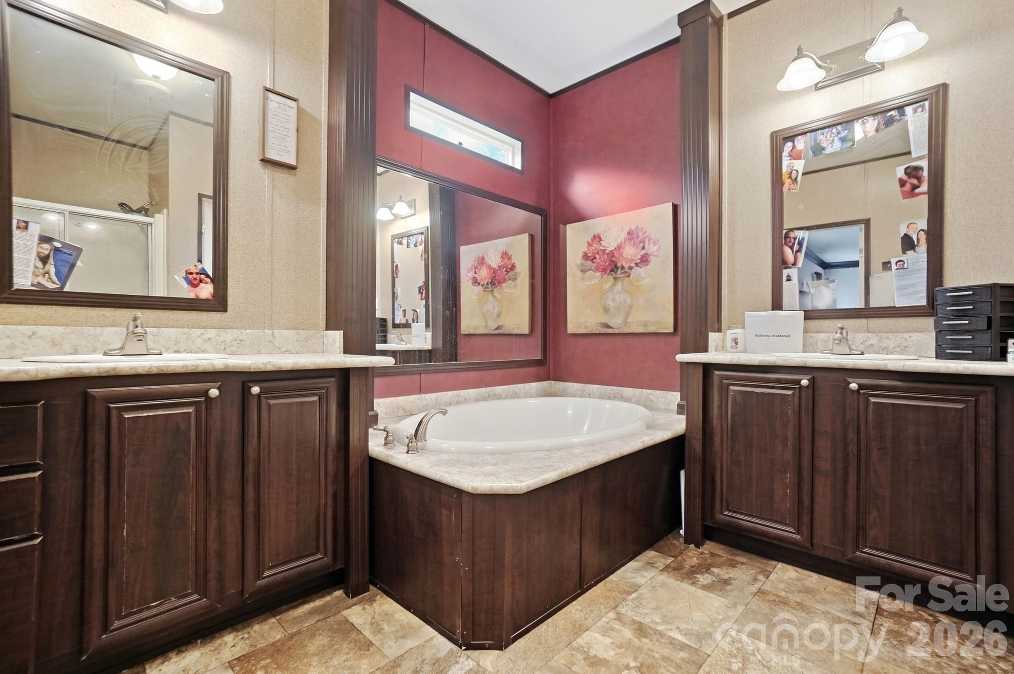 158 Cooks Lake Road Gastonia, NC 28056 - Photo 17 of 27 a bathroom with a granite countertop sink a mirror and vanity